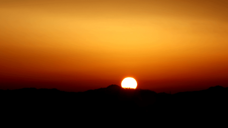 time-lapse-of-beautiful-sun-rising-over-mountain-and-hiding-behind-dark-clouds-4k-footage_hiz2ntgw_g_thumbnail-full02.png